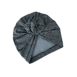 Black and white patterned shower cap on a white background