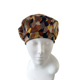 Patterned headscarf on a mannequin head against a white background