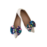 Pair of shoes with colorful floral bows on a white background