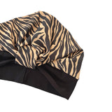Zebra print headscarf on a white background