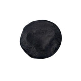 Black circular object on a white background