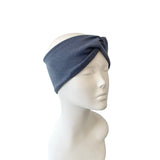 Blue headband on a mannequin head against a white background