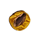 Gold and brown circular pillow on a white background