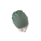 Green beanie on a mannequin head against a white background