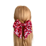 Oversized heart print Valentines Day bow clip