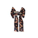 Patterned bow hair clip on a white background
