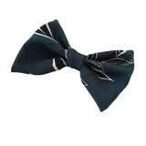 Navy blue bow tie with white leaf patterns on a white background