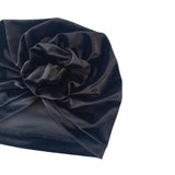 Dark blue velvet headscarf with a flower knot on a white background