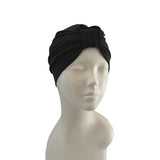 Black headscarf on a mannequin head against a white background