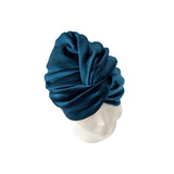 Blue headscarf on a mannequin head against a white background