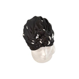 Black headscarf on a mannequin head against a white background ireland