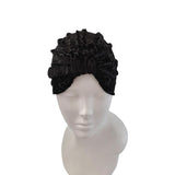 Black textured headband on a mannequin head against a white background