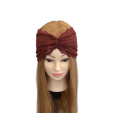 Brown lace headband on a mannequin head with long blonde hair against a white background