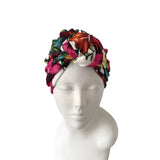 Colorful floral-patterned headband on a mannequin head against a white background