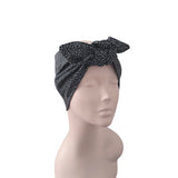 A black and gray leopard print hair wrap headband styled on a beige mannequin head, shown from a side profile against a plain white background.