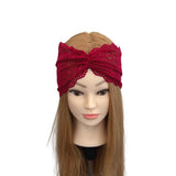Red lace headband on a mannequin head with long brown hair against a white background