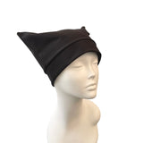 Black beanie on a mannequin head against a white background