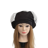 Black hat with netting on a mannequin head against a white background
