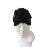 Black lace headband on a mannequin head against a white background