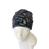 Floral patterned headscarf on a mannequin head against a white background
