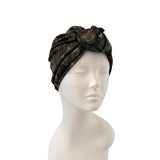 Patterned headband on a mannequin head against a white background