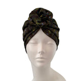 Patterned headscarf on a mannequin head against a white background
