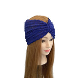 Blue lace headband on a mannequin head with brown hair against a white background