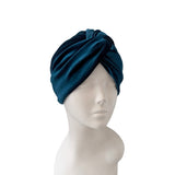 Blue headscarf on a mannequin head against a white background