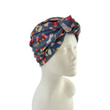 Floral patterned headscarf on a mannequin head against a white background