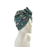 Floral patterned headscarf on a mannequin head against a white background