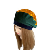 Mannequin head with multicolored headscarf on a white background