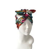 Colorful headscarf on a mannequin head against a white background