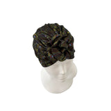 Black patterned headscarf on a mannequin head against a white background