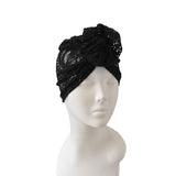 Black lace headband on a mannequin head against a white background