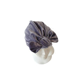 Gray velvet headband with a bow on a white background