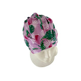 Floral patterned headscarf on a mannequin head against a white background