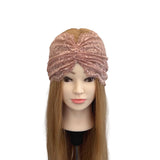 Pink lace headband on a mannequin head with long hair against a white background