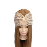 Mannequin head with a beige lace headband on a white background