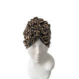 Zebra print headscarf on a mannequin head against a white background