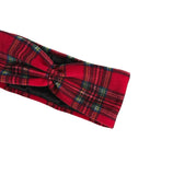 A red tartan plaid twisted headband with black and green accents, shown on a plain white background.
