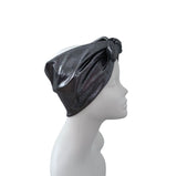 A metallic dark gray and black textured headwrap turban hat with a side knot, displayed on a white mannequin head in profile against a white background.