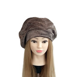 Mannequin head with a brown textured hat on a white background
