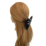 Black hair scrunchie with white design on a mannequin head with brown hair.