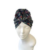 Floral patterned headscarf on a mannequin head against a white background