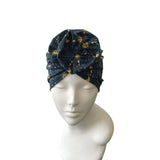 Blue patterned headscarf on a mannequin head against a white background