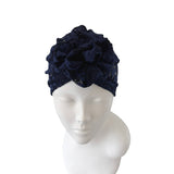 Navy blue lace headband on a mannequin head against a white background