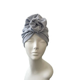 blue headscarf on a mannequin head against a white background