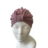 Turban on a mannequin head against a white background