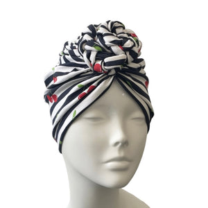 Striped headscarf on a mannequin head against a white background