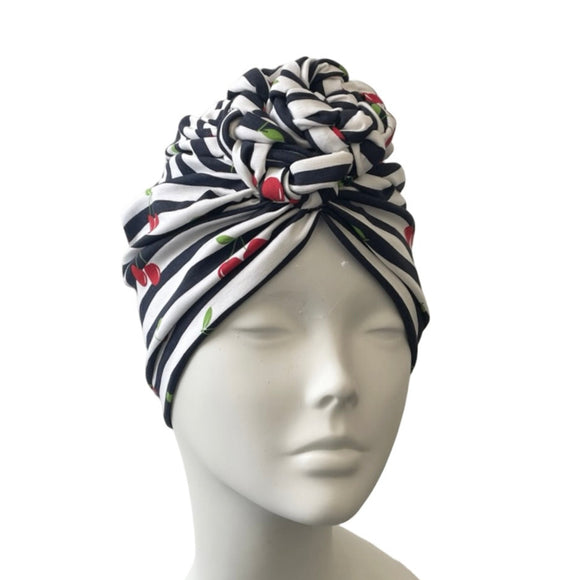 Striped headscarf on a mannequin head against a white background